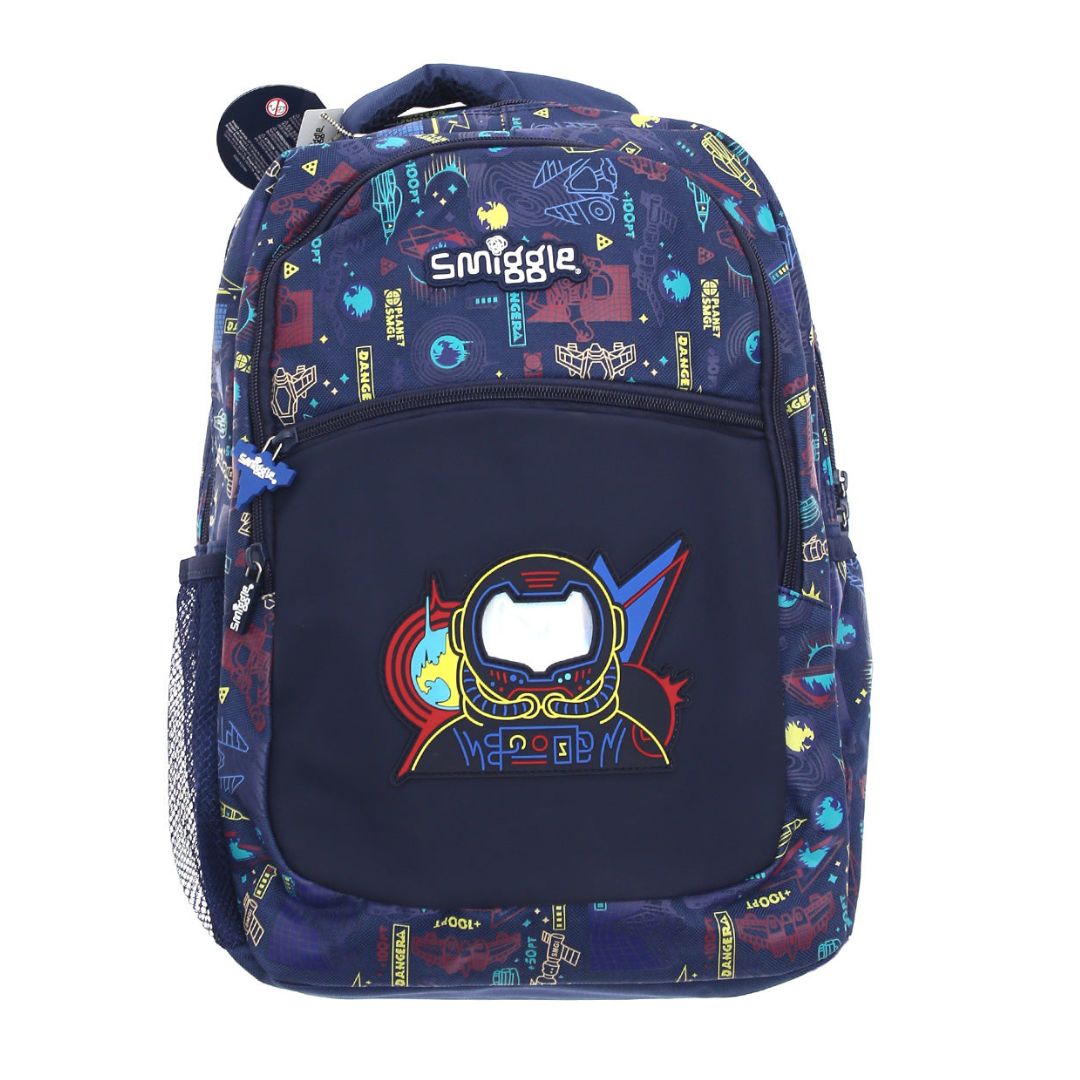 A navy blue Smiggle backpack featuring a colorful space-themed print on the upper portion and a large central graphic of a futuristic helmet with the word 'MAYBET' below it.