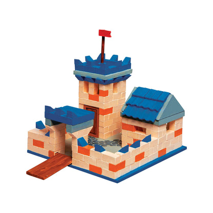 Toy castle made of interlocking bricks on a white background