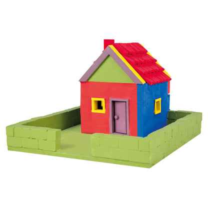 Colorful toy house made of interlocking bricks on a white background
