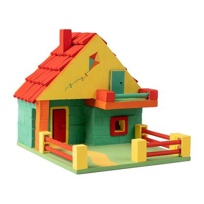 Colorful toy house made of interlocking bricks on a white background