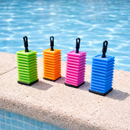Ok play colorful tiles on a pool ledge with water in the background