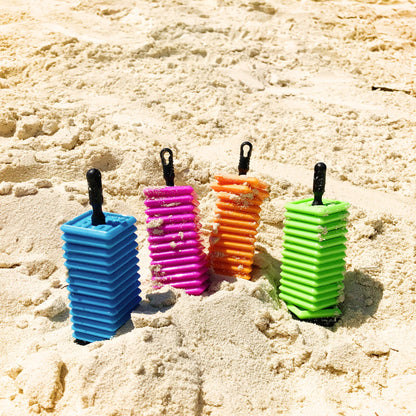 Ok play colorful tiles on a sandy surface